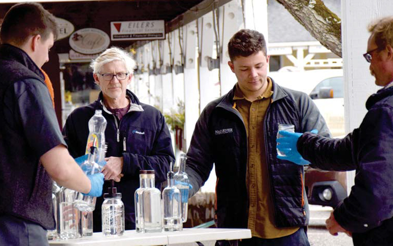 People lined up outside Mad River Taste Place last Thursday to get the free hand sanitizer made by Mad River Distillers. This week the company will again distribute the free hand sanitizer at Mad River Taste Place. Photo: Jeff Knight