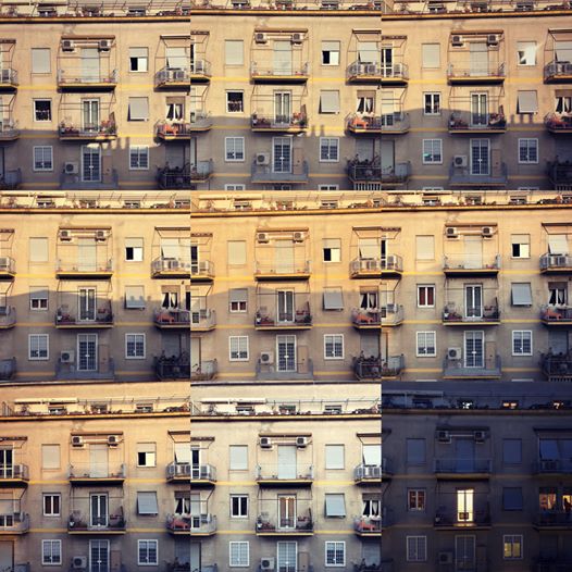 Watching the sun go down on the façade of the building across from me