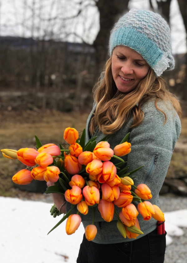 Emily von Trapp with a bouquet of tulips.