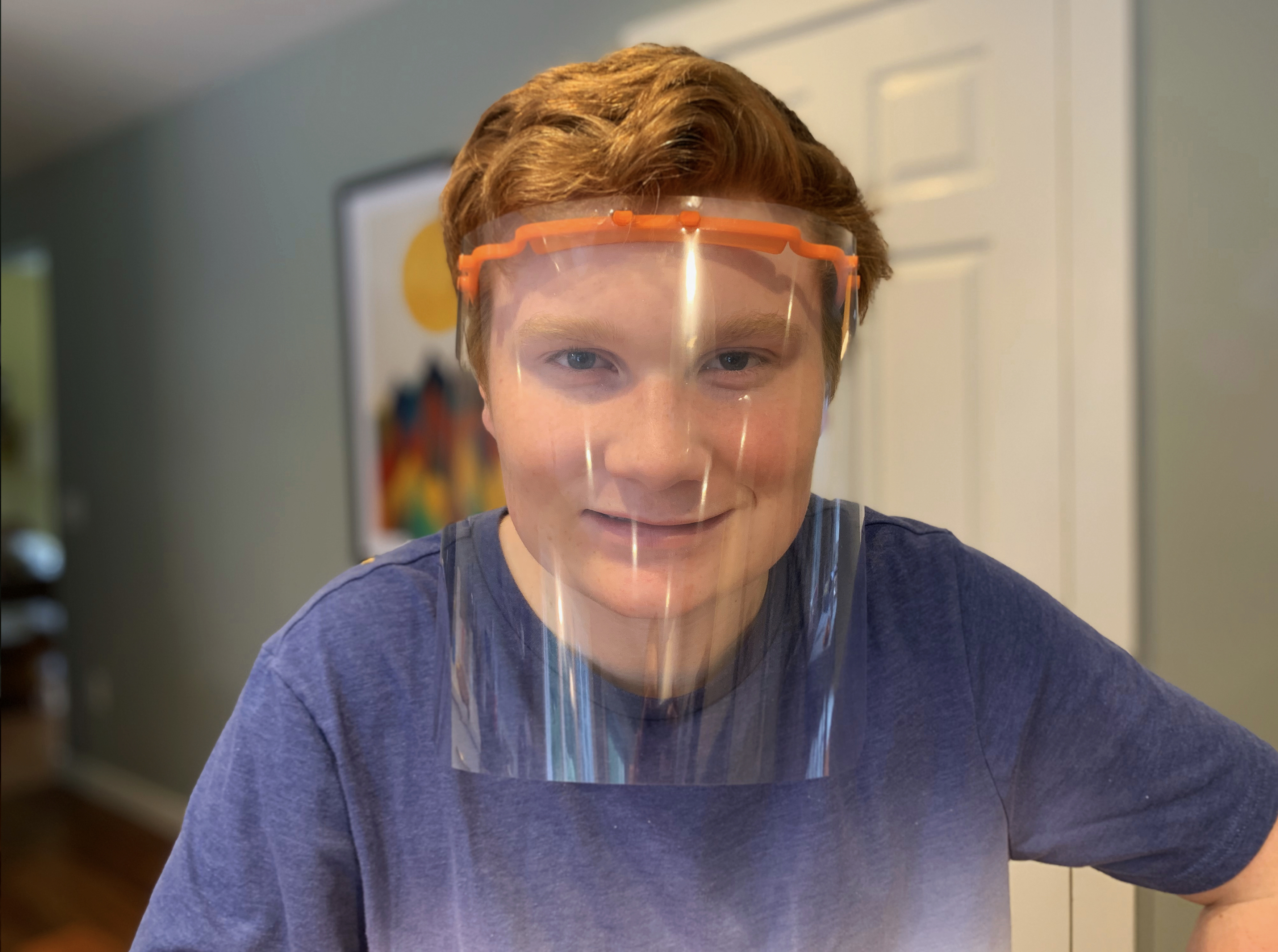 Noah Schwartz with 3D printed headband and face shield. Noah Schwartz with 3D printed headband and face shield.
