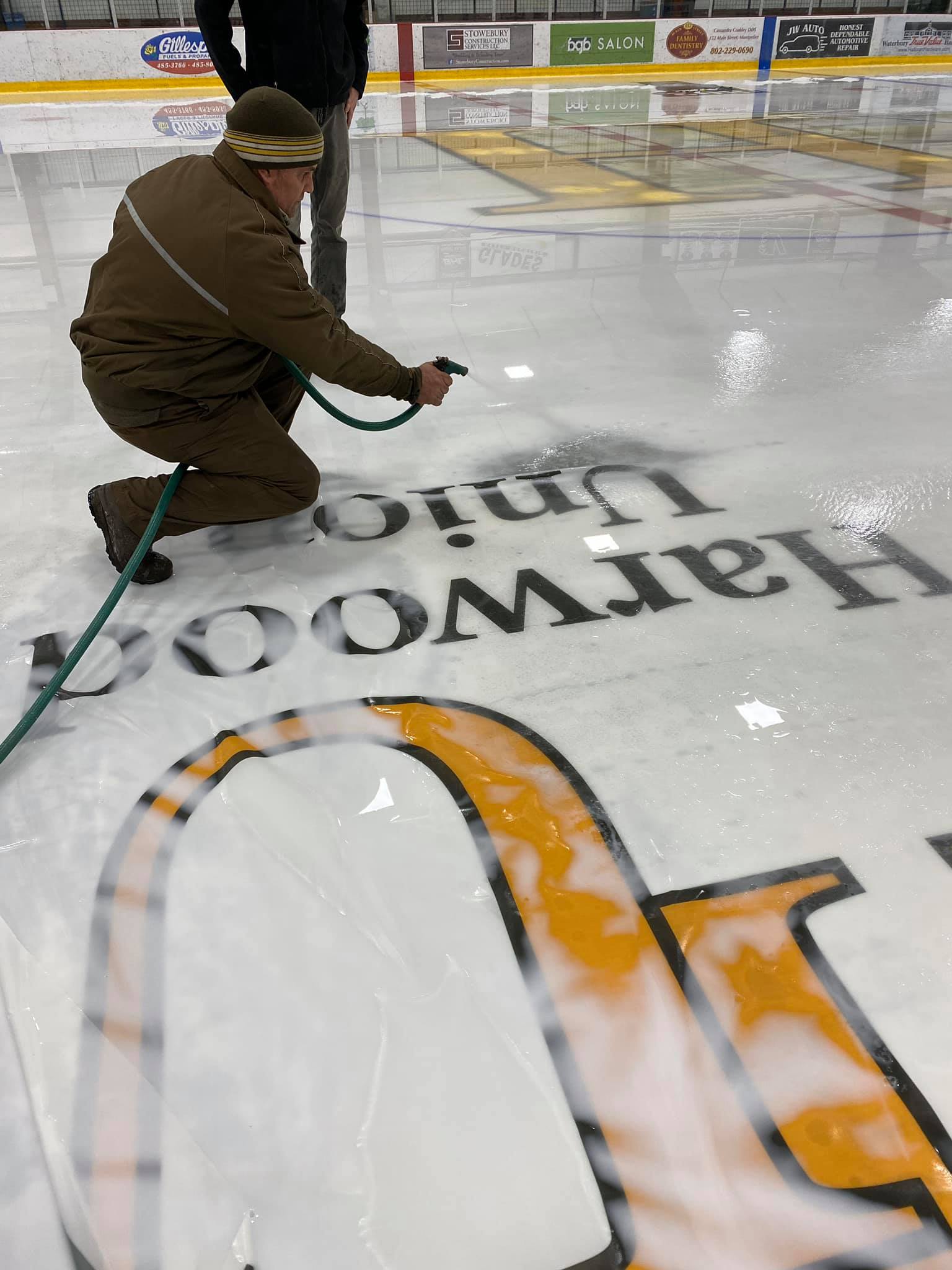 Removing ice from Waterbury Ice Center