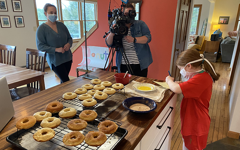 Maclyn Buckingham preps her now-famous doughnuts in her family’s kitchen before making deliveries last Friday. Courtesy photo.