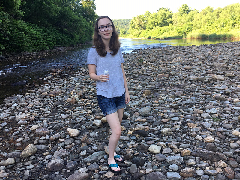 Ingrid Westervelt of Warren helps collect water samples for Friends of the Mad River Watch program this week.