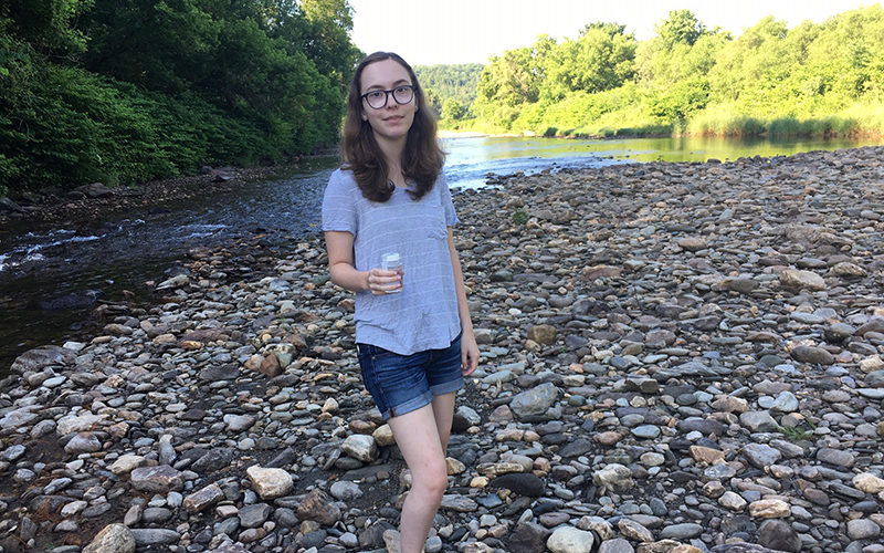 Ingrid Westervelt of Warren helps collect water samples for Friends of the Mad River Watch program this week.