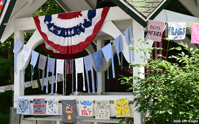 Prayer flags being hung through Warren Village. Photo: Jeff Knight