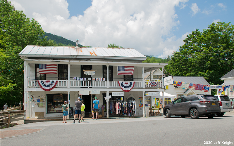 Prayer flags being hung through Warren Village. Photo: Jeff Knight