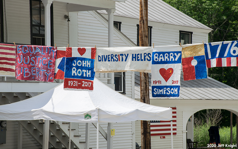 Prayer flags being hung through Warren Village. Photo: Jeff Knight