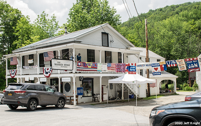 Prayer flags being hung through Warren Village. Photo: Jeff Knight