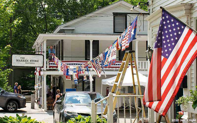 Prayer flags being hung through Warren Village. Photo: Jeff Knight