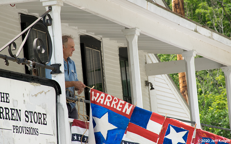 Prayer flags being hung through Warren Village. Photo: Jeff Knight