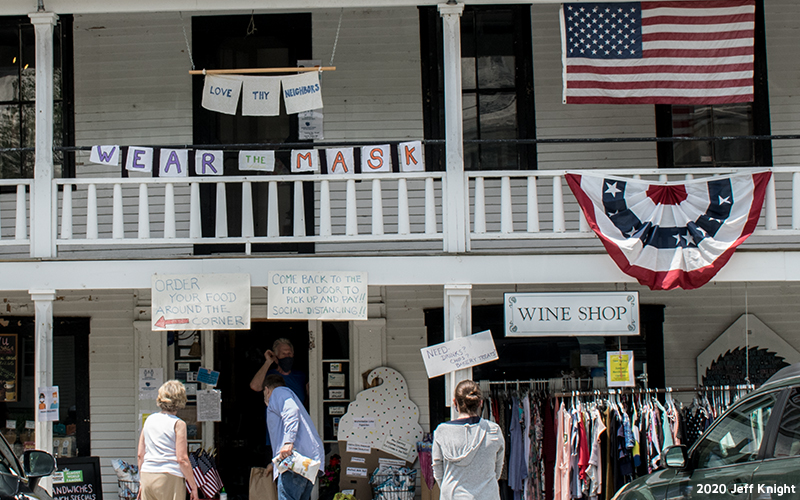 Prayer flags being hung through Warren Village. Photo: Jeff Knight