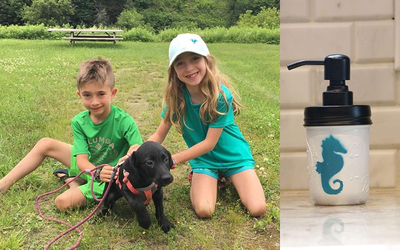 Spencer and Mirah Lutsky with their puppy, Cam and one of their specially designed soap dispensers.