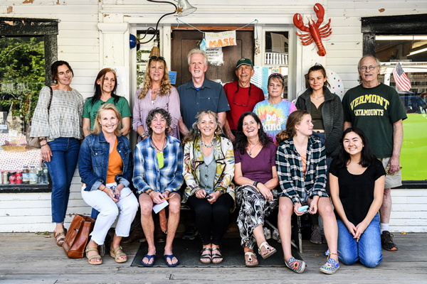 Jack Garvin, top center, on his last day at The Warren Store surrounded by fellow Warren Store staffers. Photo: Lynn Osborn