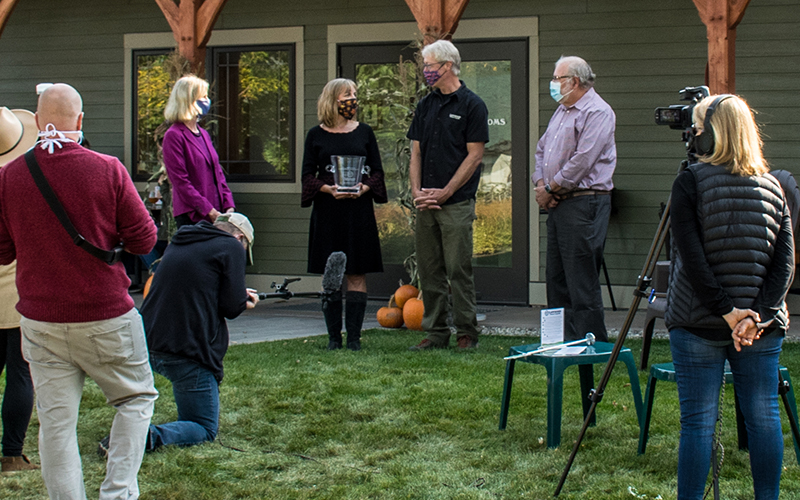 Darcy Carter, SBA, and John Boutin, VBM, present Karen and Sean Lawson with the Small Business Person of the Year award at Laswon's Brewery in Waitsfield, VT.