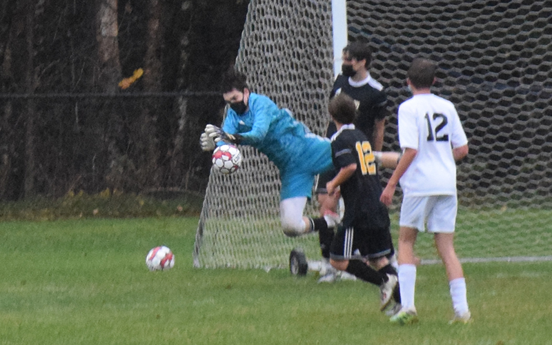 Harwood goalie Jake Collier makes a save during the first half of Harwood versus Stowe on Tuesday, October 20. Stowe won 3-2. Photo: Jeff Knight