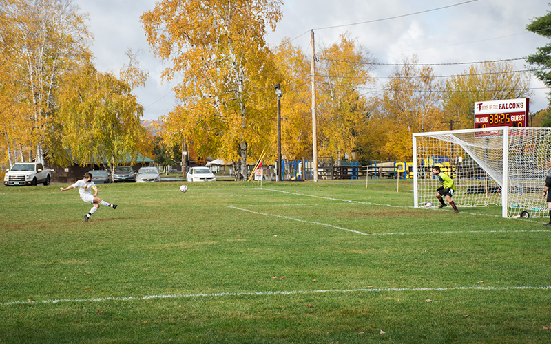 Harwood's Hayden Adams converts a penalty kick during Satruday's 2-1 win over North Country Union High School. Photo: Jeff Knight