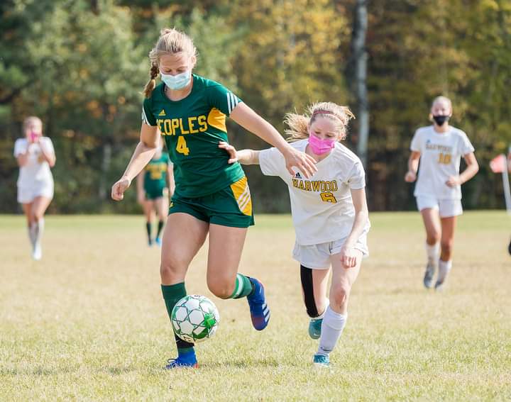 Tela Haskell #6 is defending the ball against People’s Academy. Harwood won 6-1. Photo: Ellett Merriman.