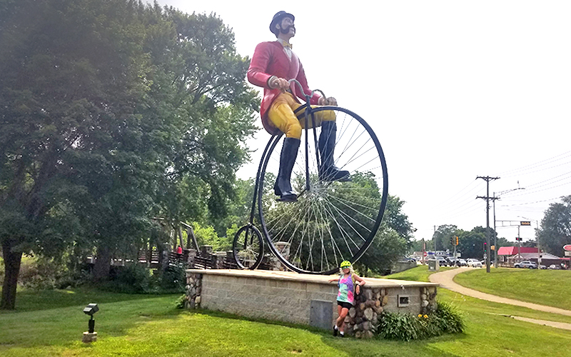 Shevonne Travers in front of Ben Bikin' Monument in Sparta, WI