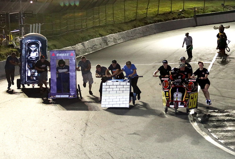 The world-famous "Port-a-Potty Grand Prix" returns to Thunder Road this Friday night. The intro photo: The 2021 "King of the Road" battle has come down to a two-man dance between Jason Corliss (#66VT) and Christopher Pelkey (#64VT). Photos: Alan Ward