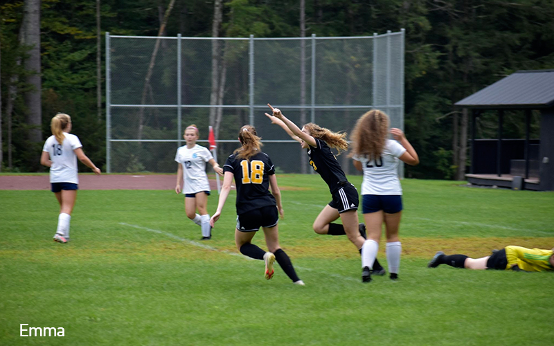 Emma Ravelin scores the equalizer for Harwood against Mount Mansfield. Photo: Alex Thomsen