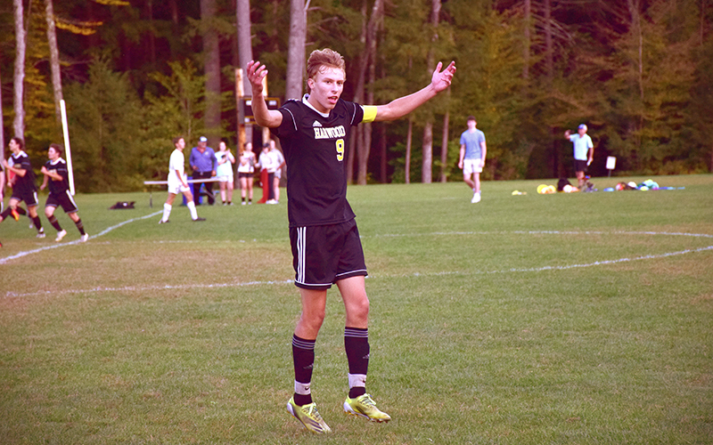 Harwood's Jordan Schullenberger celebrates with the home crowd after Harwood's 2-1 win over Montpelier on Tuesday. Photo: Jeff Knight