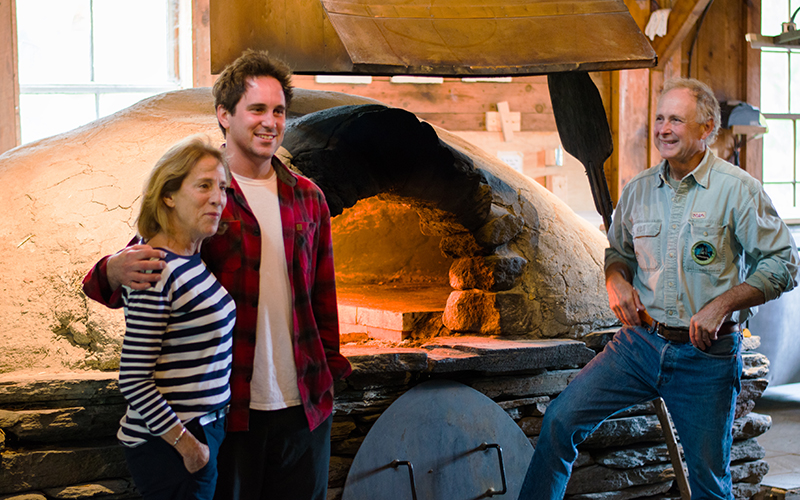 Mary (Girl George), Willis, and George Schenk in font of their 30 year old oven at American Flatbread in Waitsfield, VT. Photo: Jeff Knight