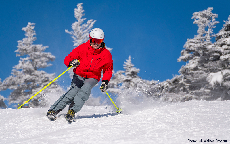 Marc Angelillo of Fayston sports a huge grin while skiing on opening day at Sugarbush. Photo: Jeb Wallace-Brodeur.