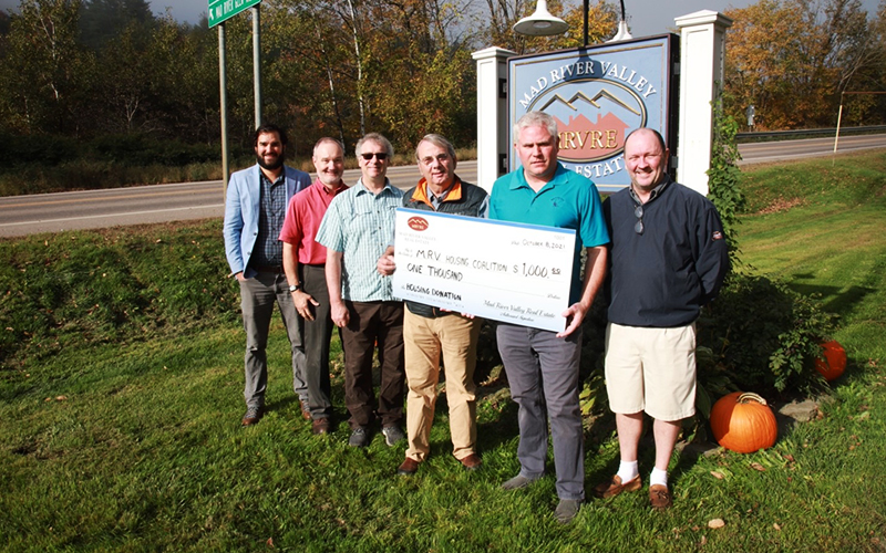 MRVRE team presents donation to MRV Housing Trust member Bob Ackland, from left, Brian Kitchens, MRVRE, Brent Adams, MRVRE, Steve Robbins, MRVRE,  Ackland, Erik Reisner, MRVRE and David Dion, MRVRE