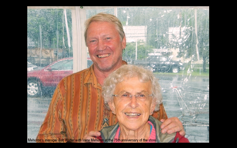 Mehuron's manager Bob Welter with Irene Mehuron at the 75th anniversary of the store.