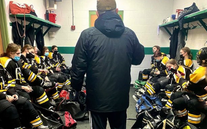 Harwood Girls' Hockey Coach Mike Vasseur talks to his team during the semifinals.