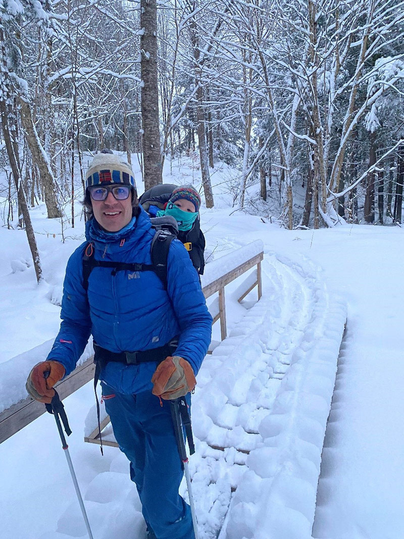 Matt Williams, new president for Friends of the Mad River board of directors, out for a ski over Doctor’s Brook in Moretown with his son Silas. Photo: Nina Otter.