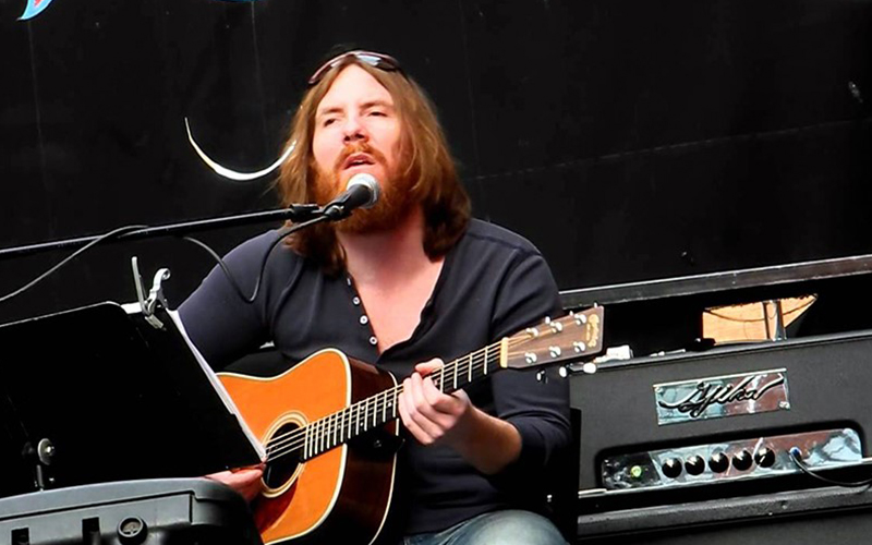 Singer song writer Bob Wagner playing guitar.