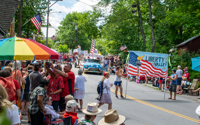 Liberty Valley w/Sickie the Ambulance make their way past the judging stand at the 2022 Warren, VT Fourth of July Parade. Photo: Jeff Knight