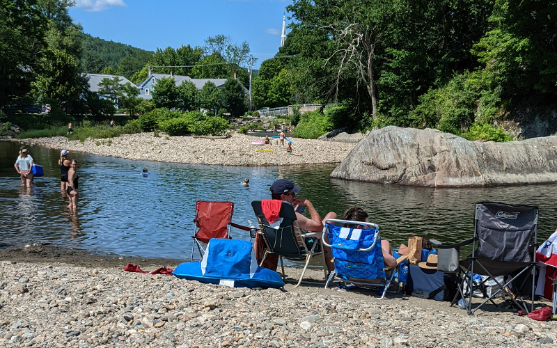 Families enjoying a swim in Waitsfield near the covered bridge. Photo: Erika Nichols-Frazer