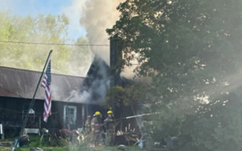 Firefighters battle to save the Viens home on the North Fayston Road in Fayston on July 28. Photo: Jim Darrow