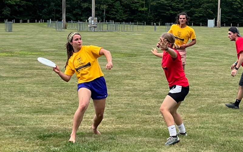 Rose Hahr prepares to throw a forehand or "flick" to a fellow teammate on Yellow Fever during Saturday's ultimate tournament, the Mad Hatter! 