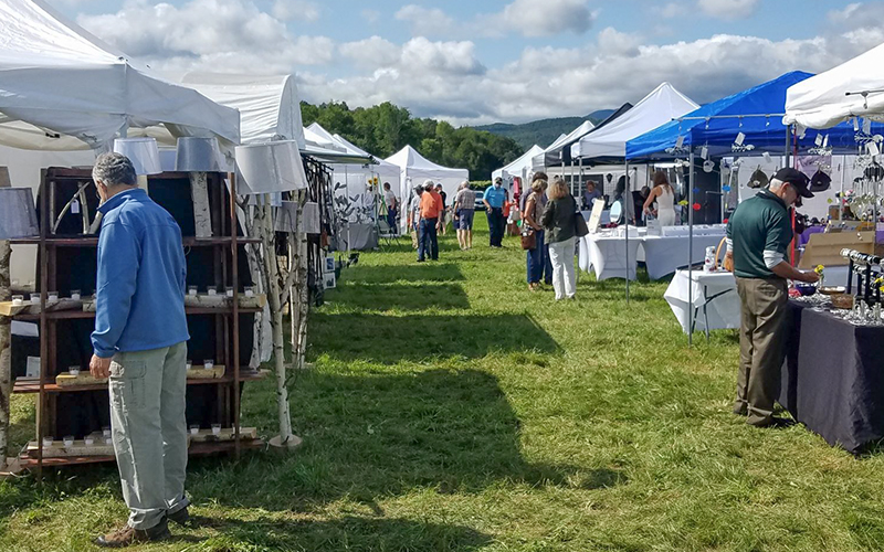 Shoppers move from tent to tent at the Mad River Valley Craft Fair.