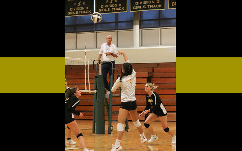 HU senior Amalia Iskandarova tips the ball with Mia Lapointe and Abigail Holter covering.