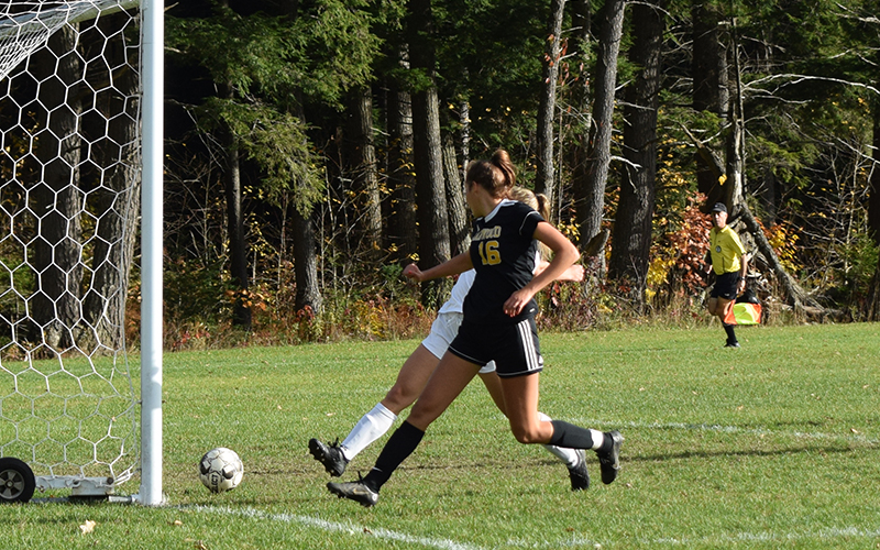 Harwood's Lindsey Boyden slides a goal home against GMVS in Harwood's first round playoff victory. Boyden had three goals in Harwood's 10-0 victory. Harwood play Mt. Abraham on Friday at Harwood. Photo: Jeff Knight