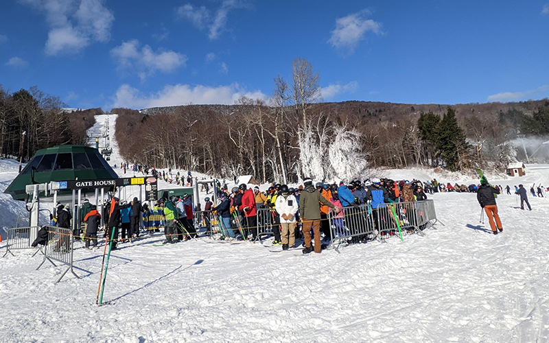 Lines of skiers waiting to get a chance to carve turns on opening day 2022-23 at Sugarbush Resort. Photo: Erika Nichols-Frazer