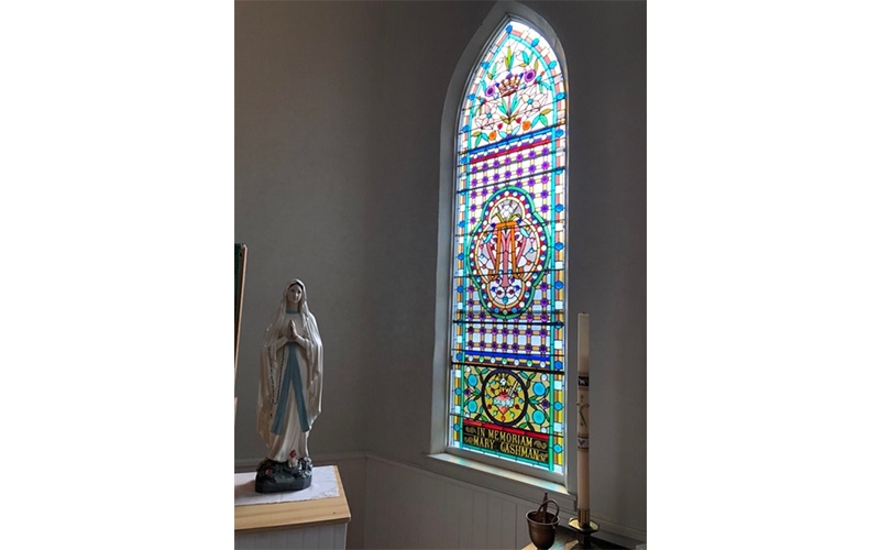 One of the stained-glass windows in St. Patrick Church in Moretown.