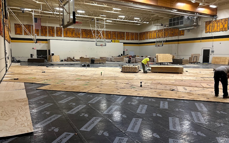 This look from Friday, December 2, shows moisture barrier material going down on top of the gym floor's concrete slab before new wood flooring is to be installed. Courtesy photo.