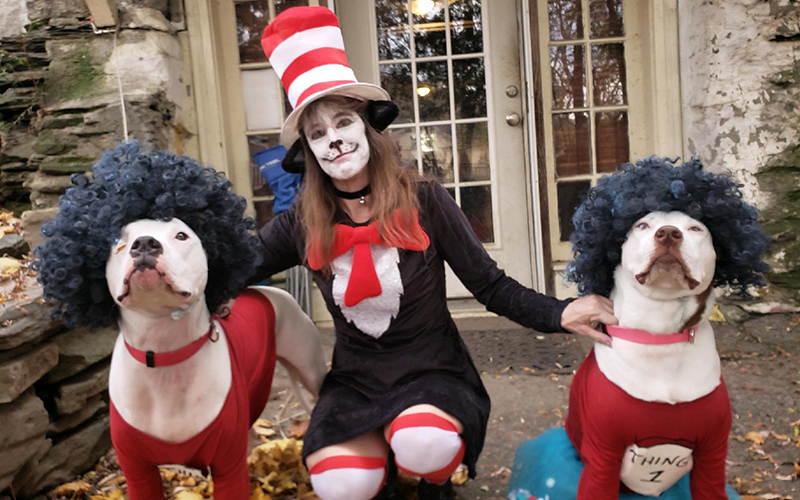 Tina Wood dressed as the Cat In The Hat and her dogs Khaleesi and Dennis as Thing 1 and Thing 2