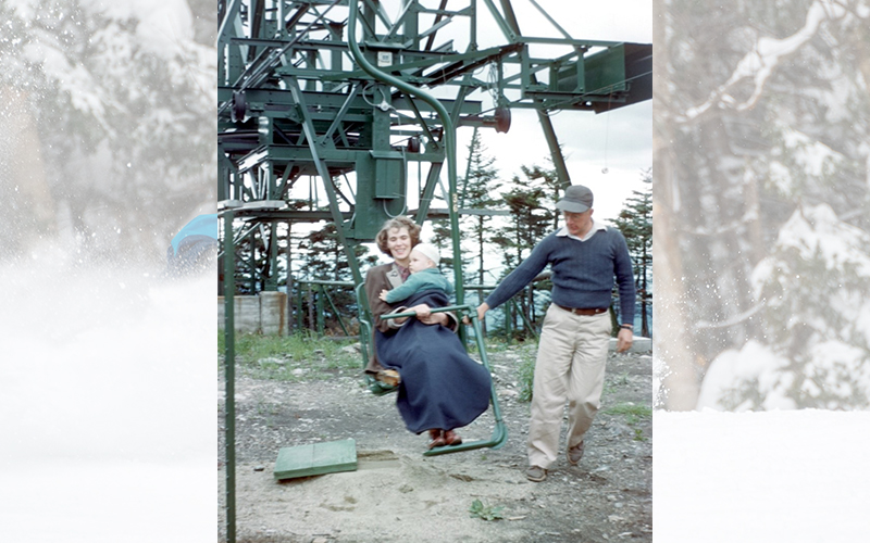 Steve Joslin's mother, Betty Joslin, holding his brother David in her arms. They are assisted by George Neill.