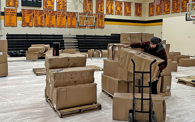 preparing for the reflooring of the Harwood High School gym. Photo courtesy Gordon Miller.