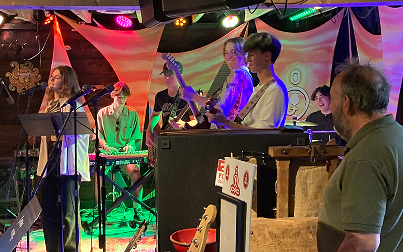 Bruce Sklar looks on as his jazz/assembly band plays a gig at Zen Barn in Waterbury, VT. Photo: Jeff Knight