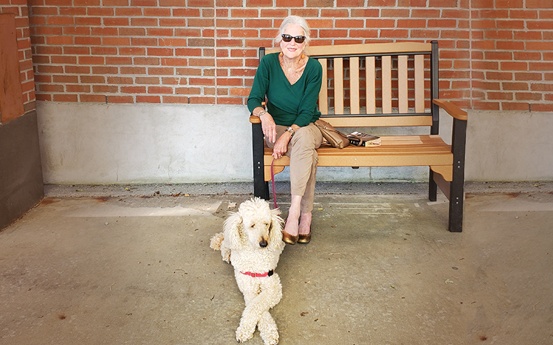 Billi Schloss and wingman Lila the poodle.