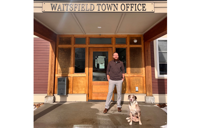 Randy Bittingham and dog in front of the Waitsfield Town Office.