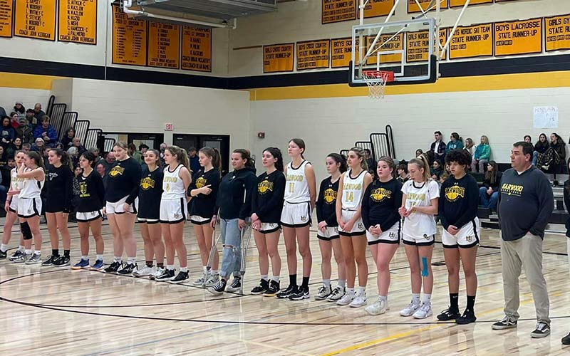 Harwood Girls' Basketball and coach Tom Young. Photo: Harwood Boosters