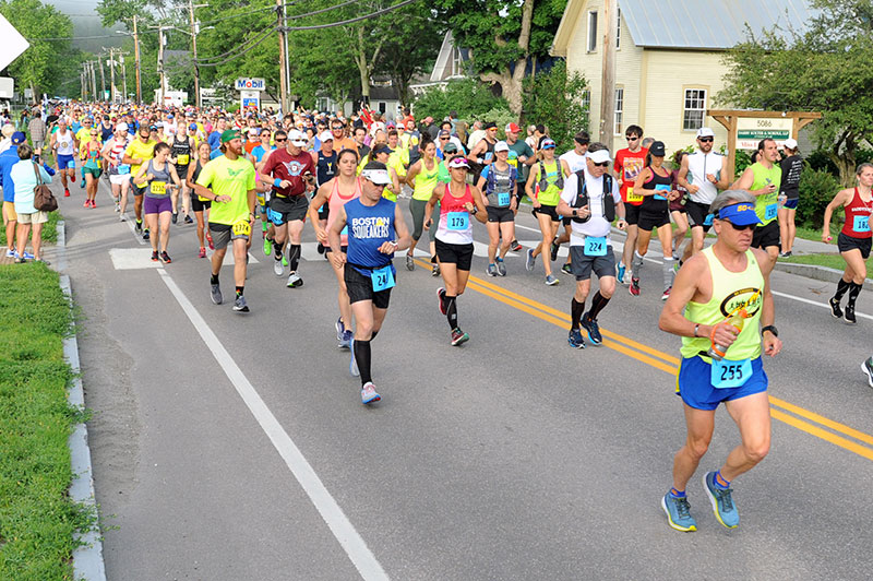 Marathoners fill the streets of Waitsfield for the annual Mad Marathon, half-marathon, and relay marathon.